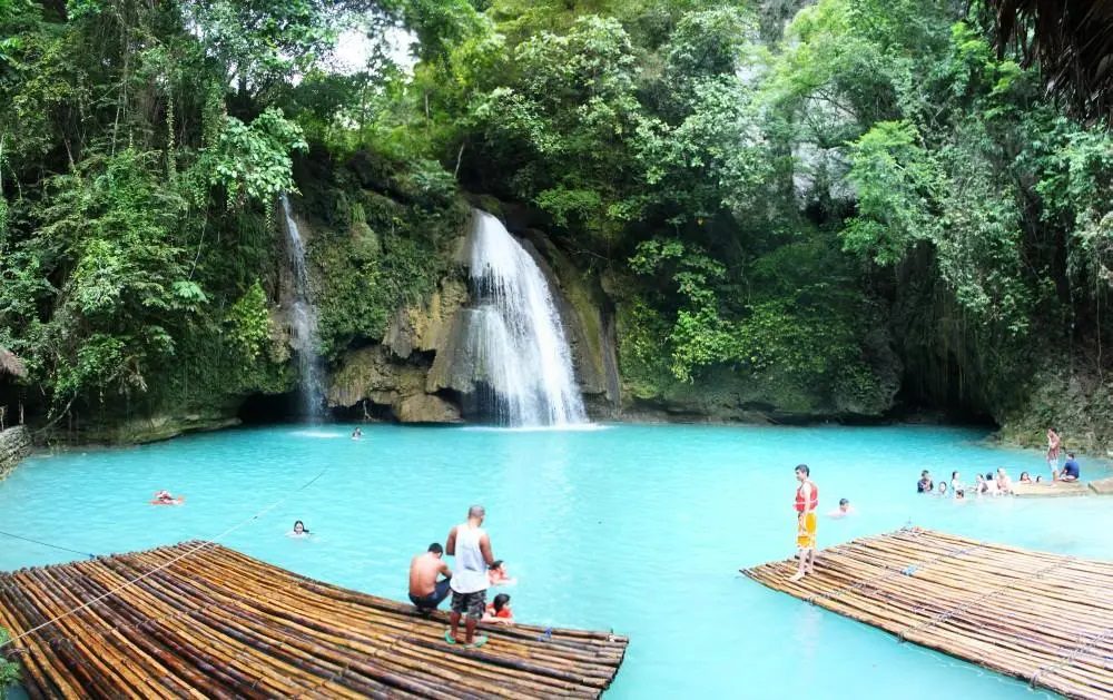 Cebu tourist spots, travel guide to Cebu, Kawasan Falls, Osmeña Peak, Basilica del Santo Niño, Tumalog Falls, Mactan Shrine, Simala Shrine, Fort San Pedro, Bantayan Island, Temple of Leah, 10,000 Roses Cafe, Cebu attractions, Cebu activities, Cebu accommodation, Cebu cuisine, Cebu transportation, Cebu travel safety, Instagrammable spots in Cebu, adventure in Cebu, Philippines travel, Southeast Asia travel, Island hopping in Cebu, Diving in Cebu, Cebu canyoneering, Cebu heritage walk, Cebu food tour, Cebu Lechon, Cebuano street food, Whale shark watching in Cebu, Mountain trekking in Cebu,